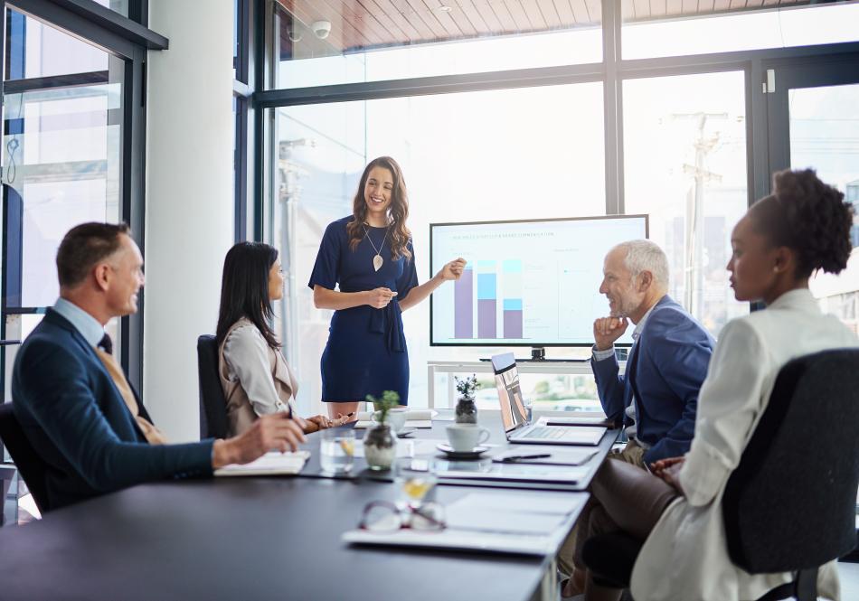 Woman presenting in a business meeting